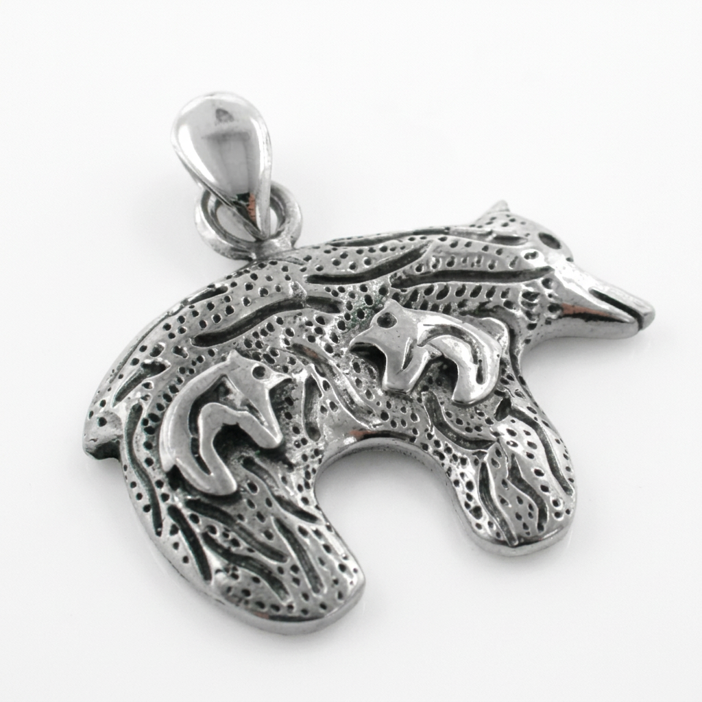 Textured sterling silver bear pendant with two raised bear motifs and a polished bail on white.
